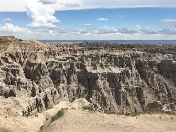 The Badlands National Park greets you with spectacular geological formations.